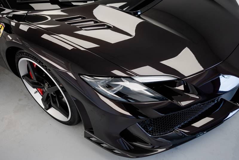Protection PPF complète sur Ferrari 296 Speciale noir Purosangue près de Rennes et Laval